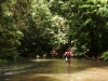 Anne-Marie crossing the river in the rainforest