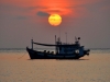 Fishermen boat at sunset